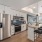 Luxury kitchen with island, located at The Riv, a new apartment building in Denver