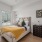 Bedroom with wood-style flooring and large window