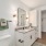 Bathroom with framed mirror, storage and large closet