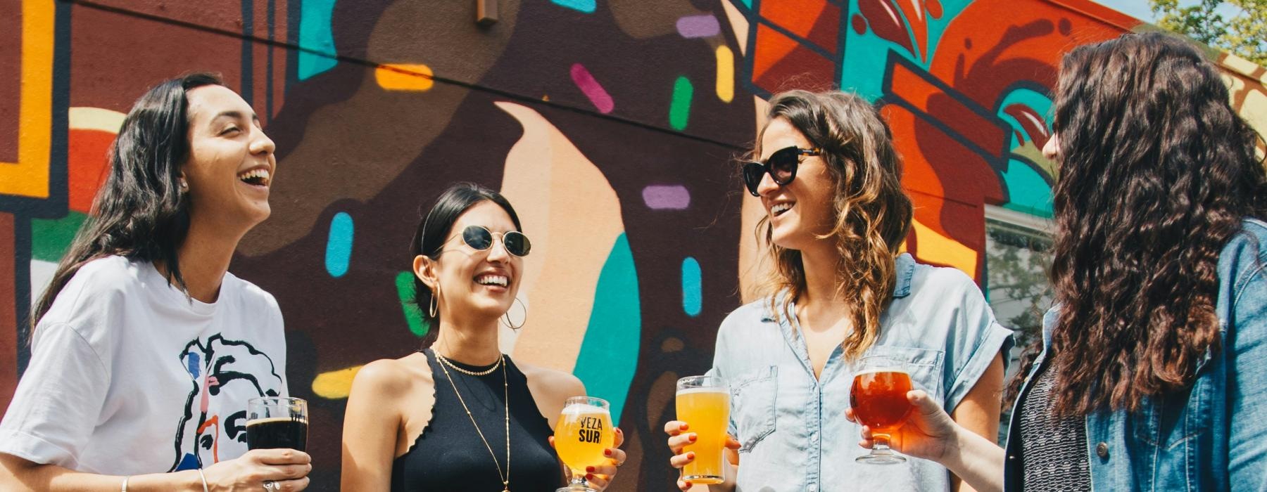 a group of people holding drinks